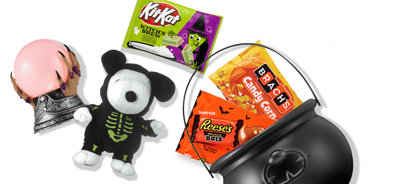 The Halloween Shop, a witch's globe, Snoopy in a skeleton suit, bags of KitKat, Brach's candy corn and Reese's Bats candy