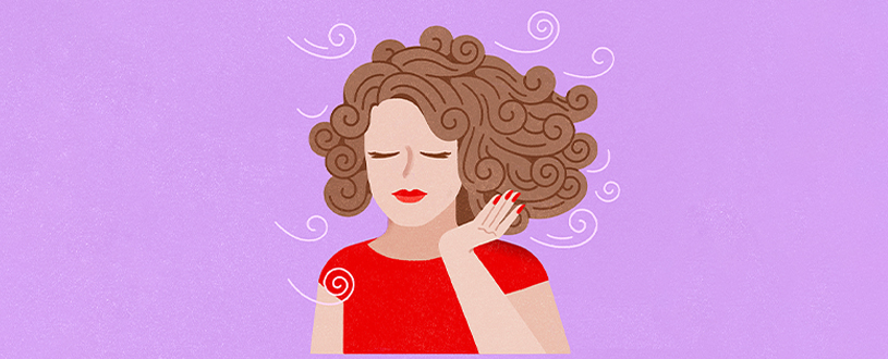 girl with curly hair blowing in the wind