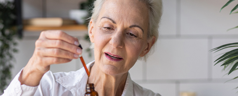 Woman using retinol serum