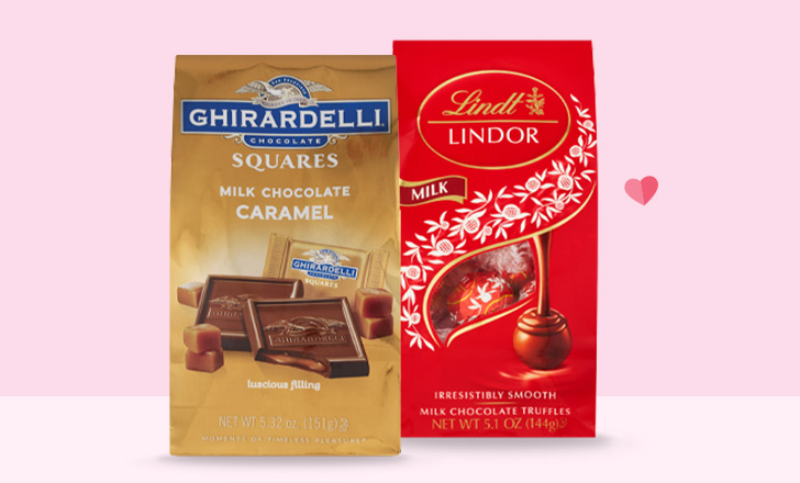 A bag each of Ghirardelli milk chocolate caramel squares and Lindt milk chocolate truffles