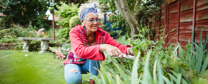 Woman gardening in her yard