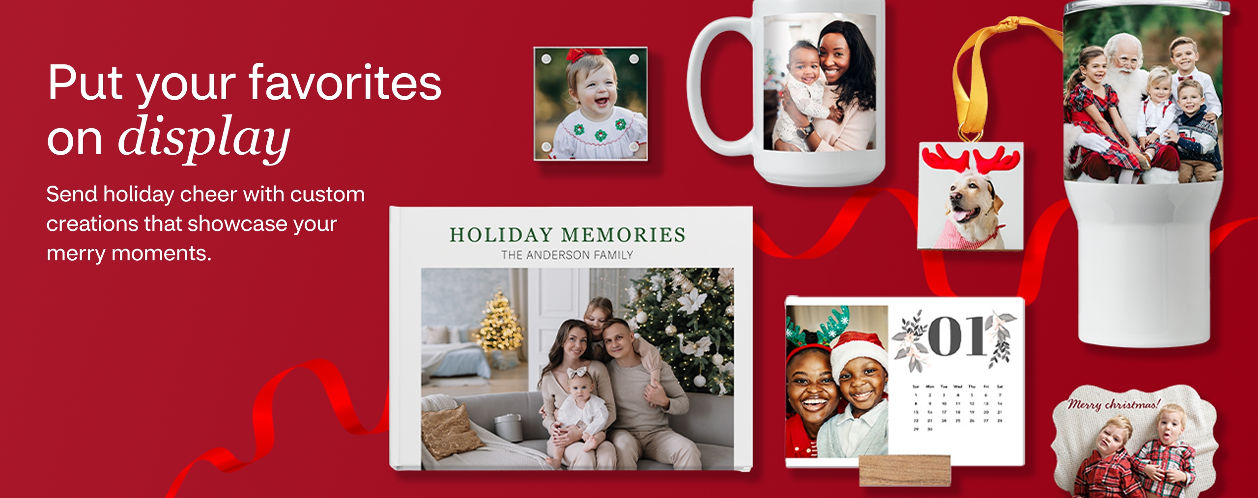 Personalized photo gifts against a red background with red ribbon, including holiday family calendars, an ornament of a dog with reindeer antlers, a white tumbler with children sitting on Santa's lap and other photos of kids on magnets.