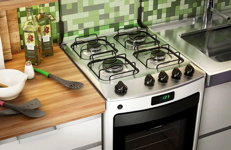 Fogão branco embutido na bancada da cozinha com lista de vantagens: facilidade para limpeza e mais barato que inox