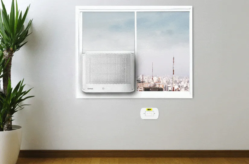 Ar-condicionado instalado na janela com destaque para a tomada 220v