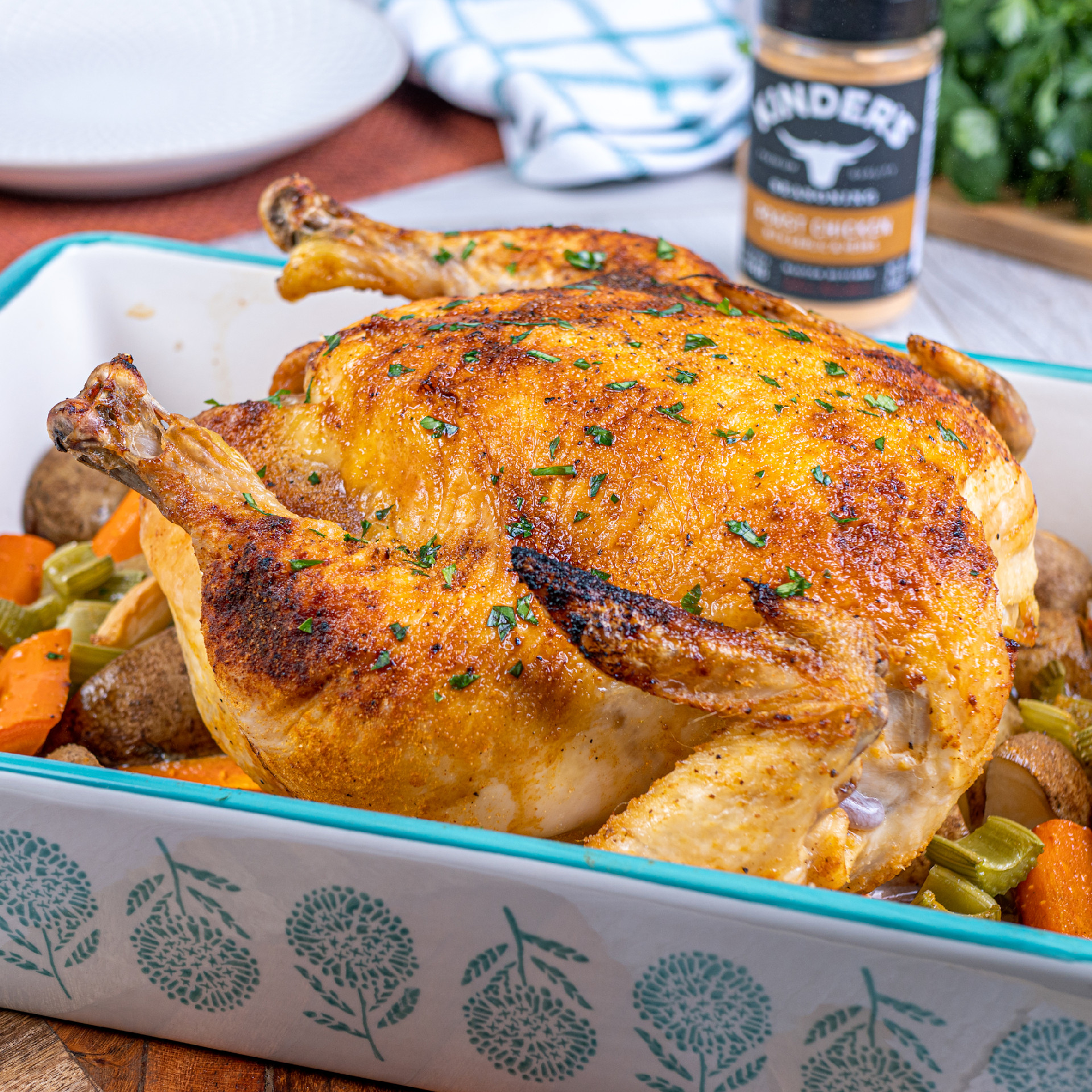 Roasted chicken in casserole dish with vegetables