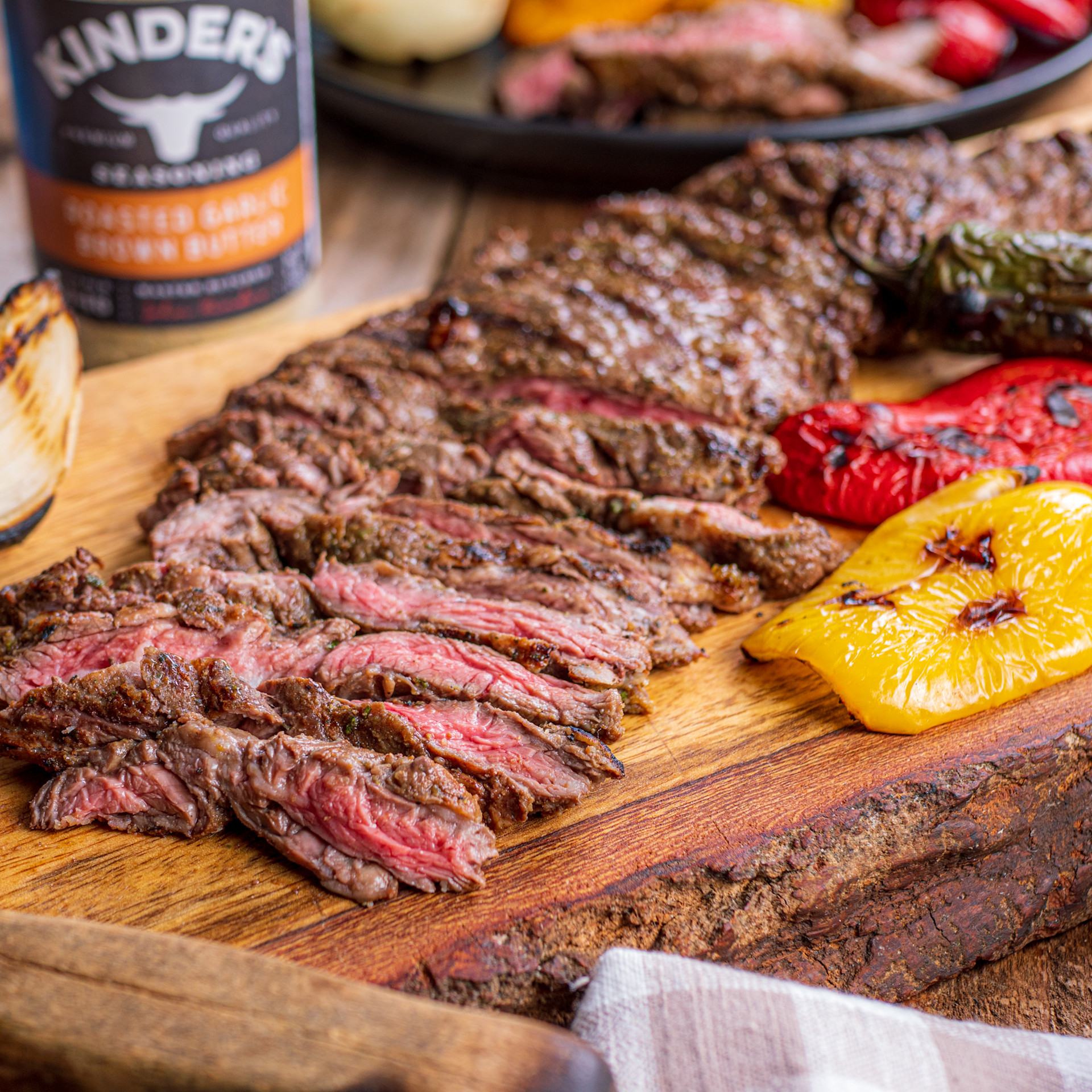 Sliced grilled skirt steak on cutting board