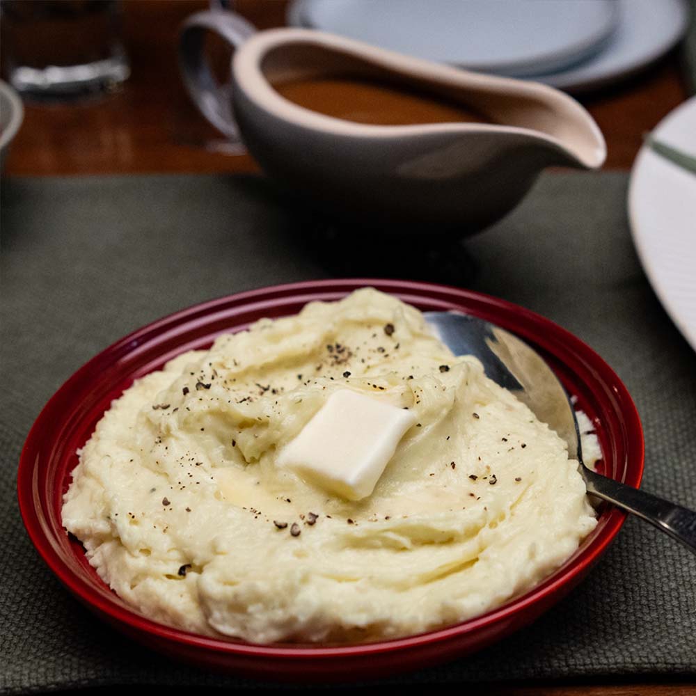 creamy mashed potatoes with butter and gravy