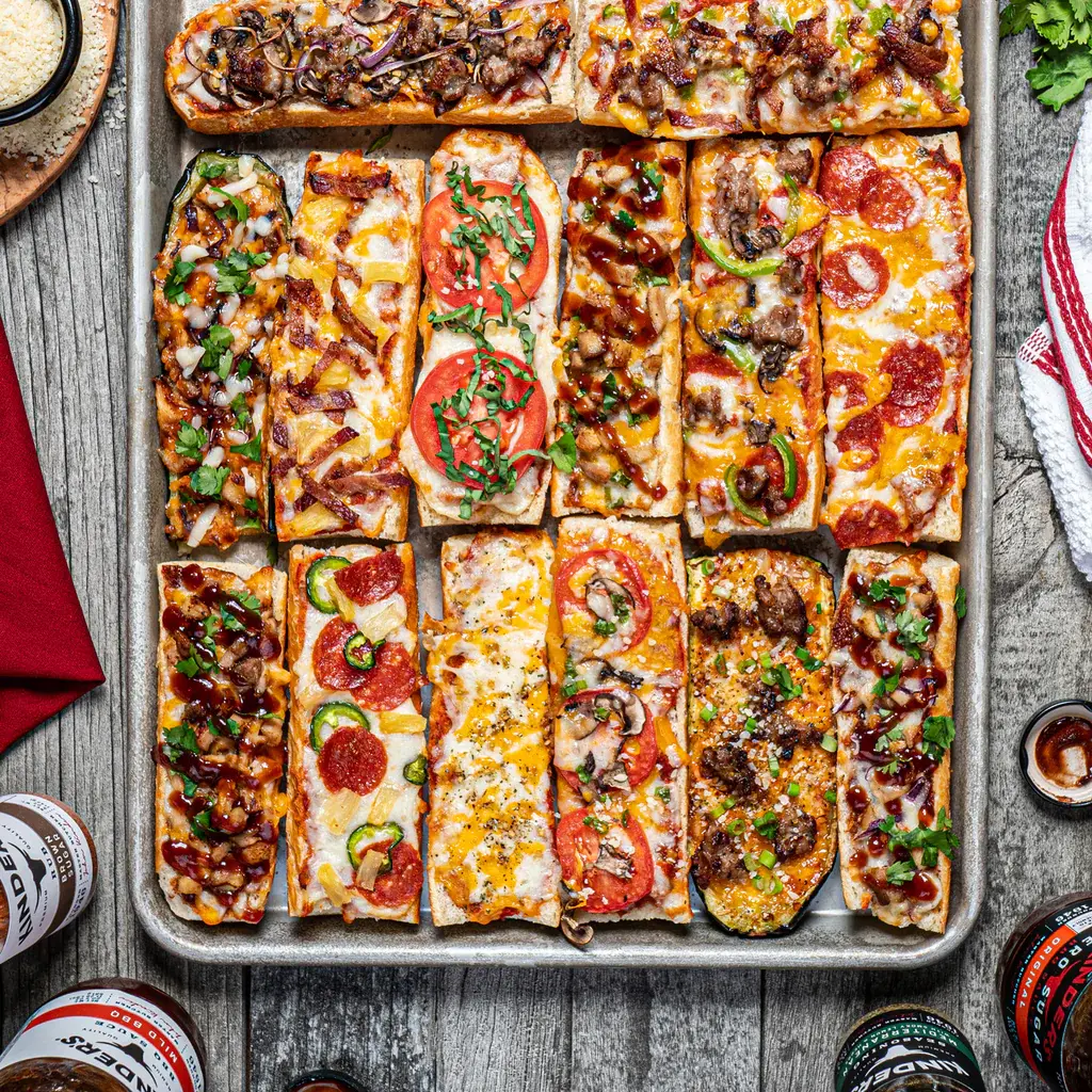Sheet pan with multiple slices of french bread pizza