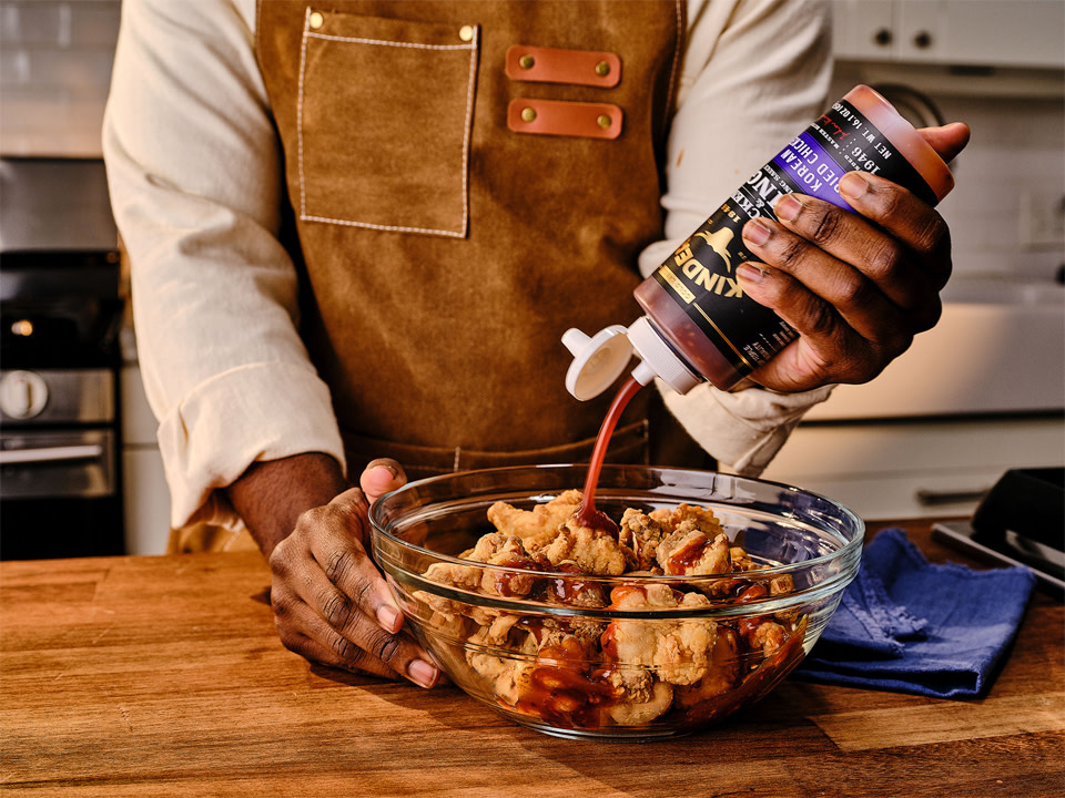 Saucing bowl of chicken