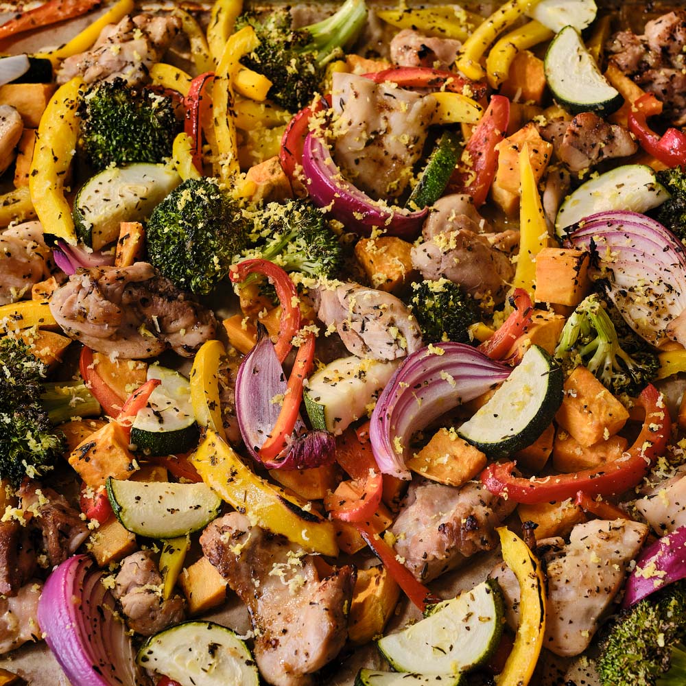 Close up of sheet pan chicken and veggies