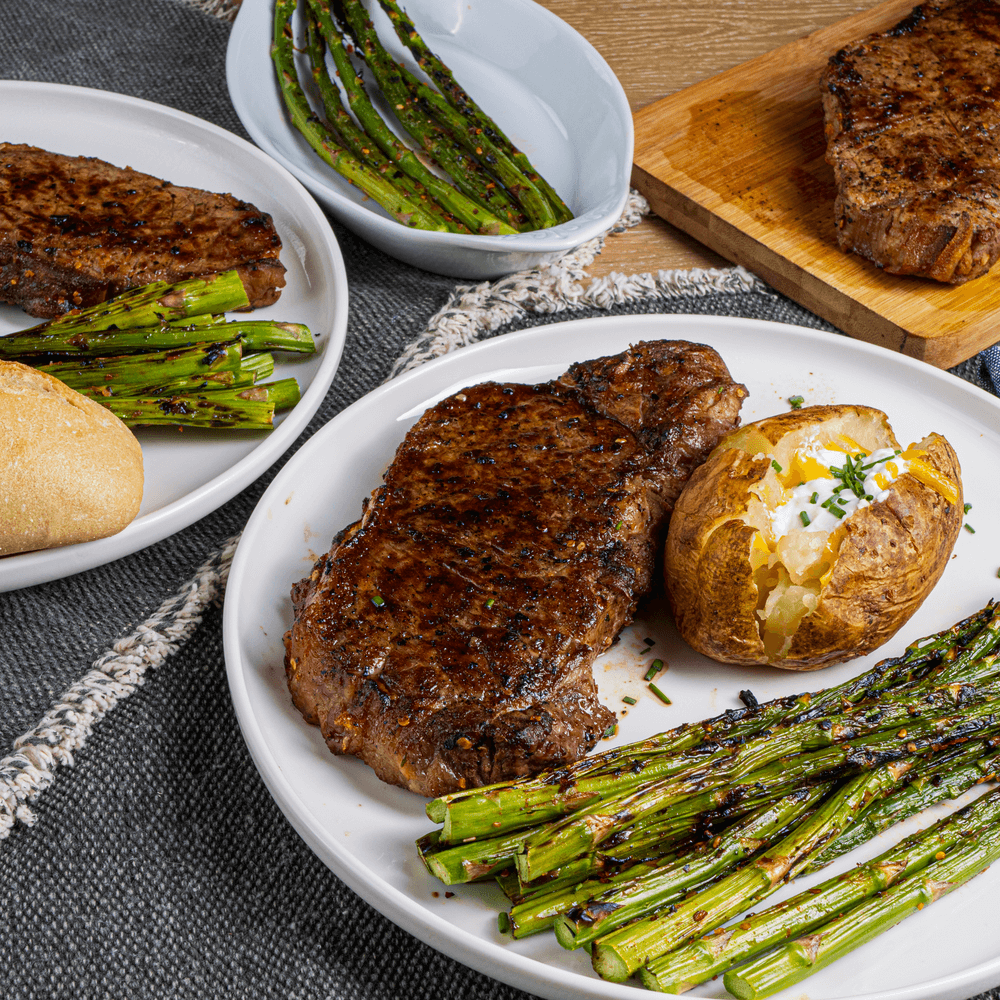 Chili Crunch New York Strip Steak with Asparagus & Baked Potato