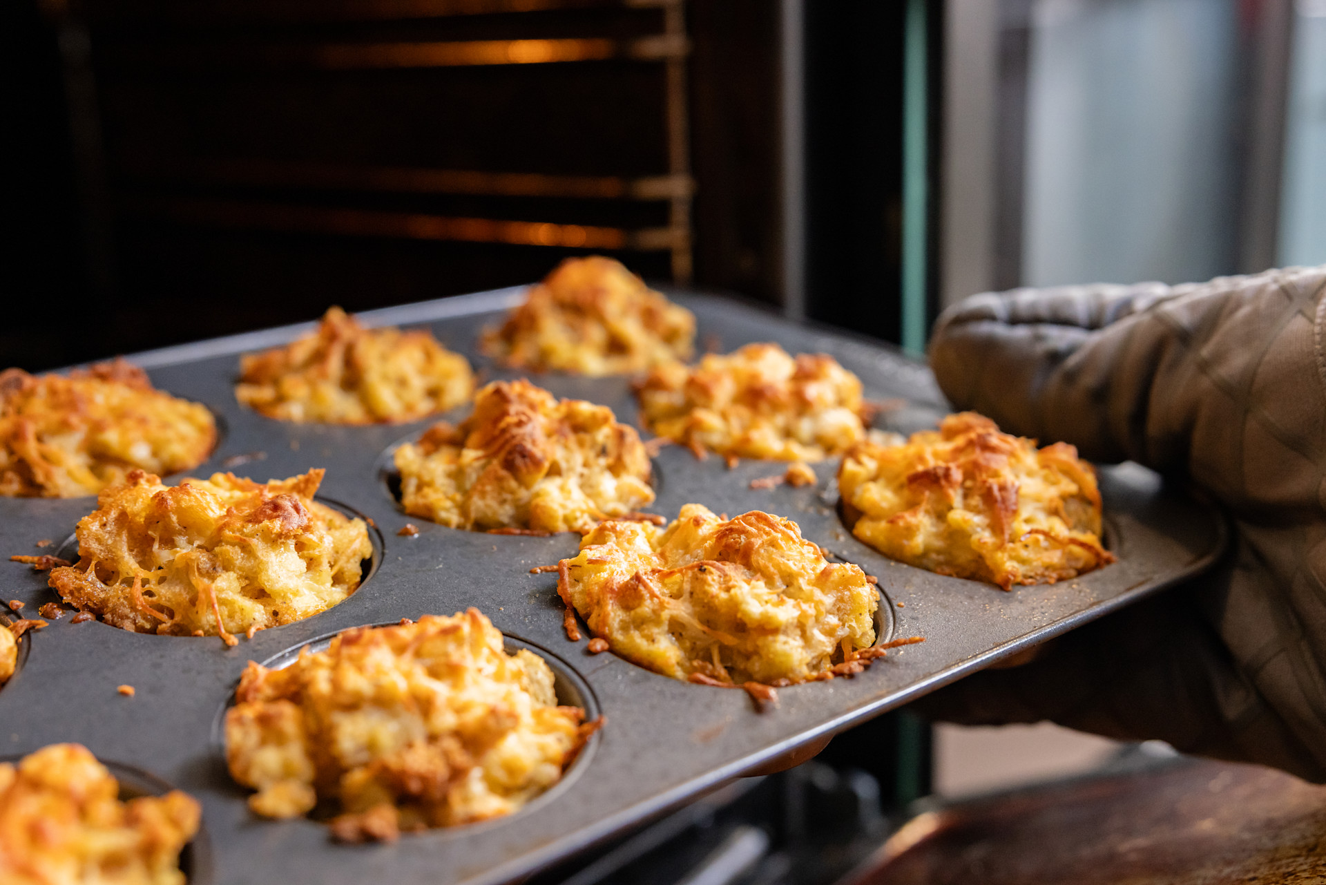 stuffing muffins going into the oven