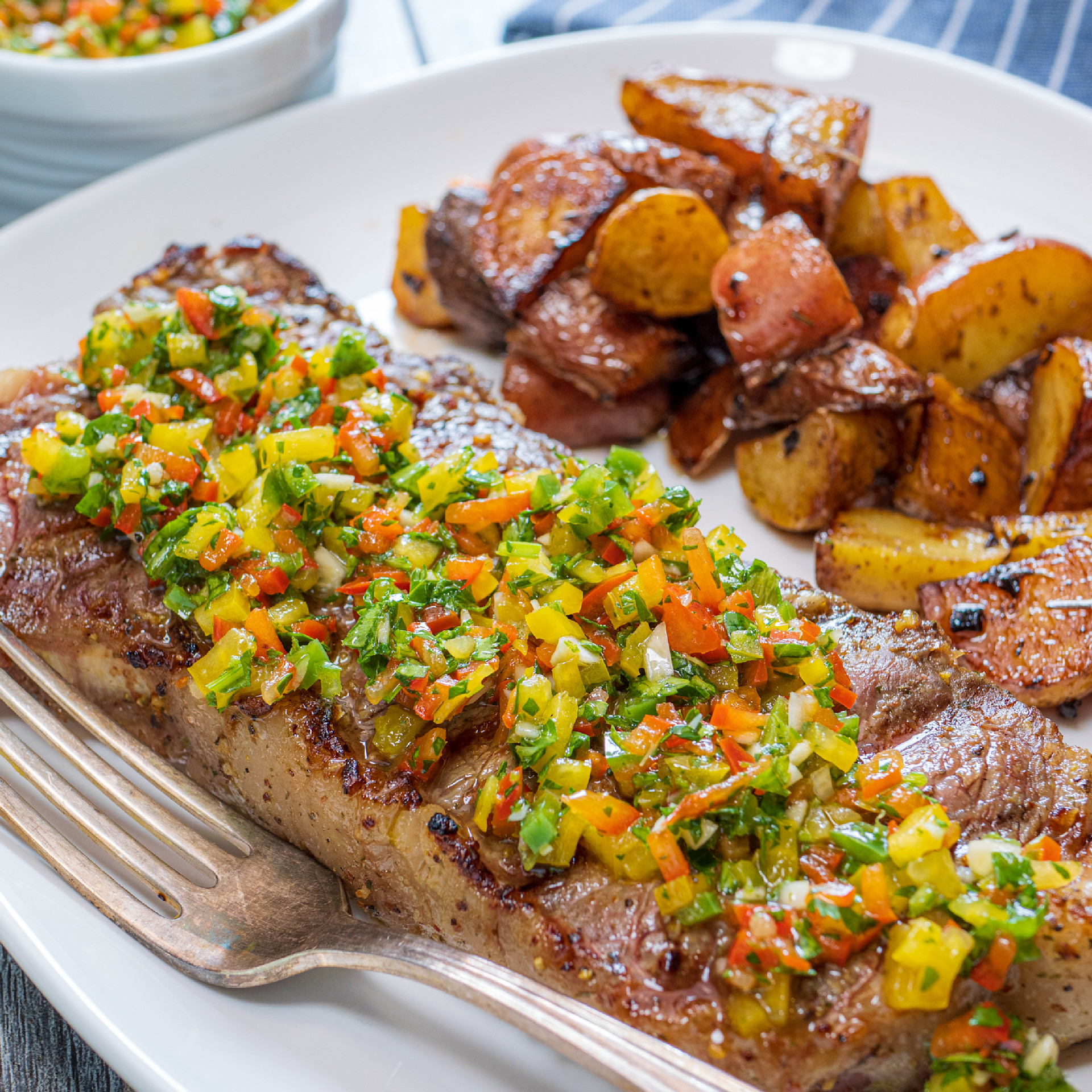 Ny strip steak topped with chimichurri