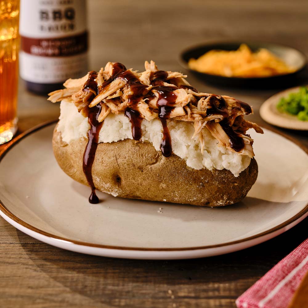 Baked potato with pulled chicken and BBQ sauce