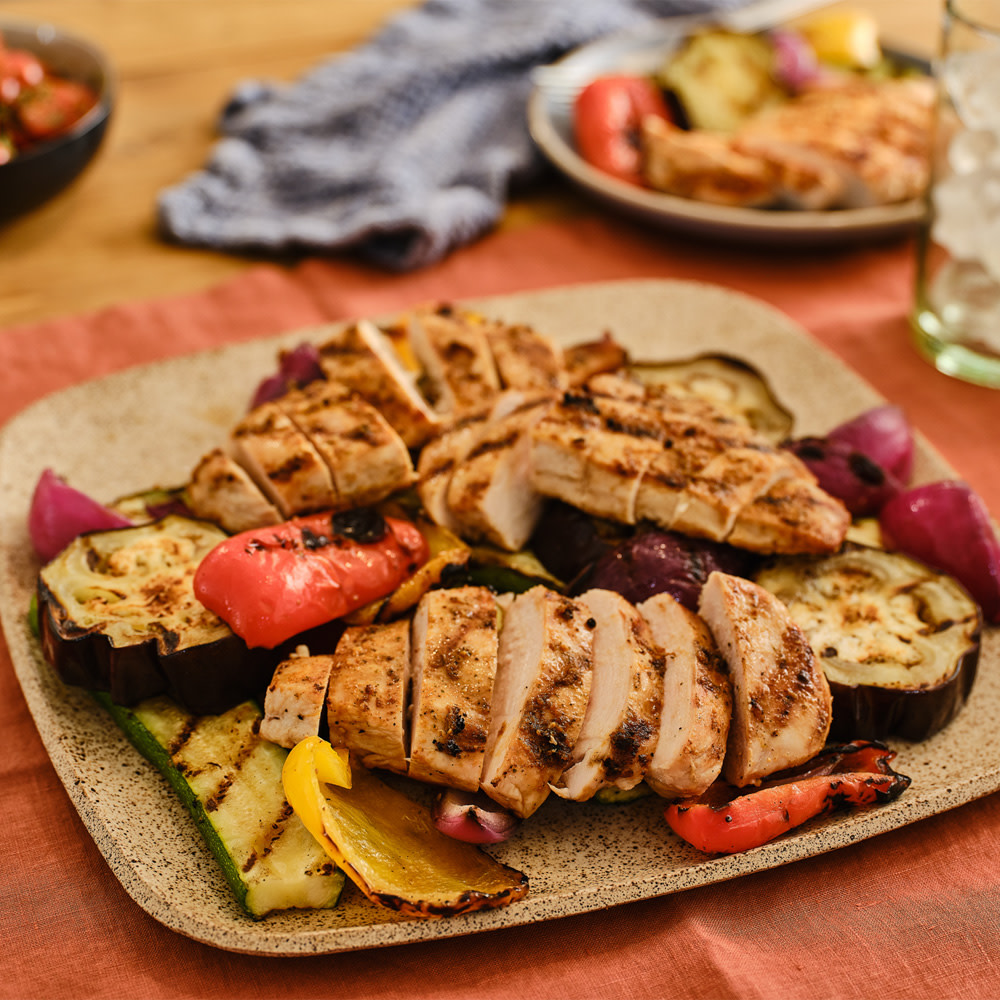 Grilled chicken and veggies on the table