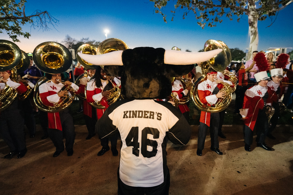 Kinder's bull mascot with marching band