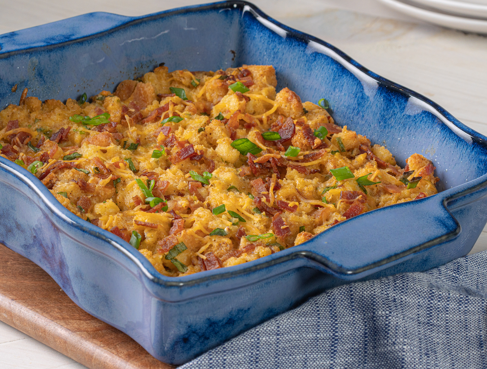 Cheesy Bacon Skillet Stuffing in blue casserole dish