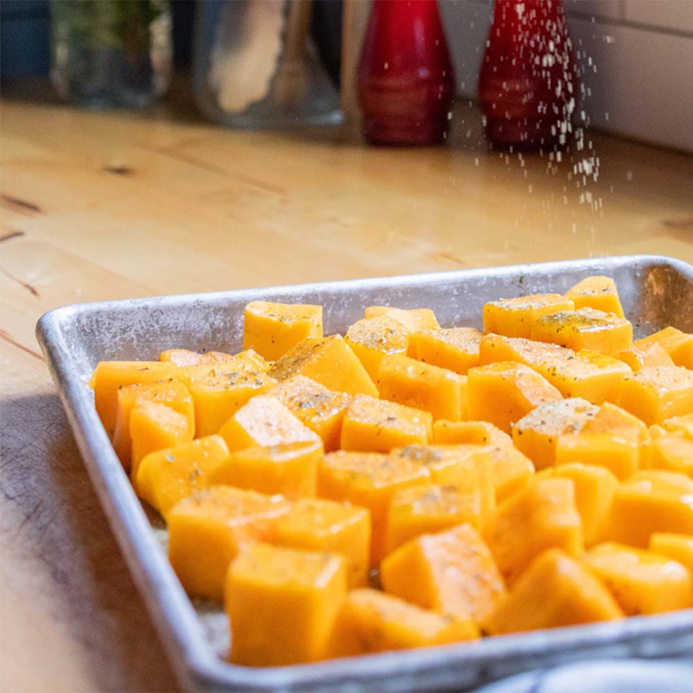 seasoned butternut squash on roasting sheet