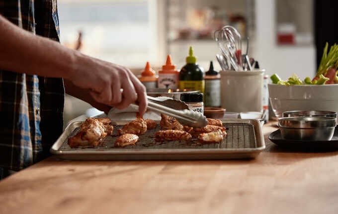 Making chicken wings in the Kinder's kitchen