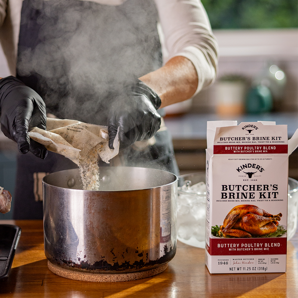 Emptying seasonings from the brine kit into a pot