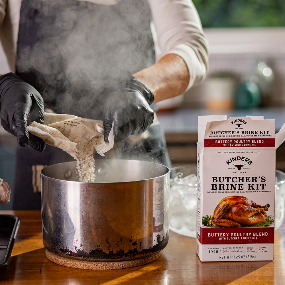 Emptying seasonings from the brine kit into a pot