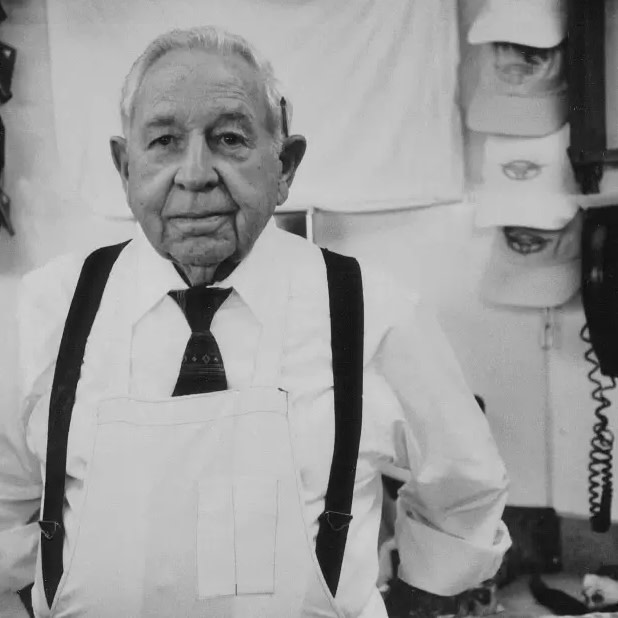 older man in butchers uniform