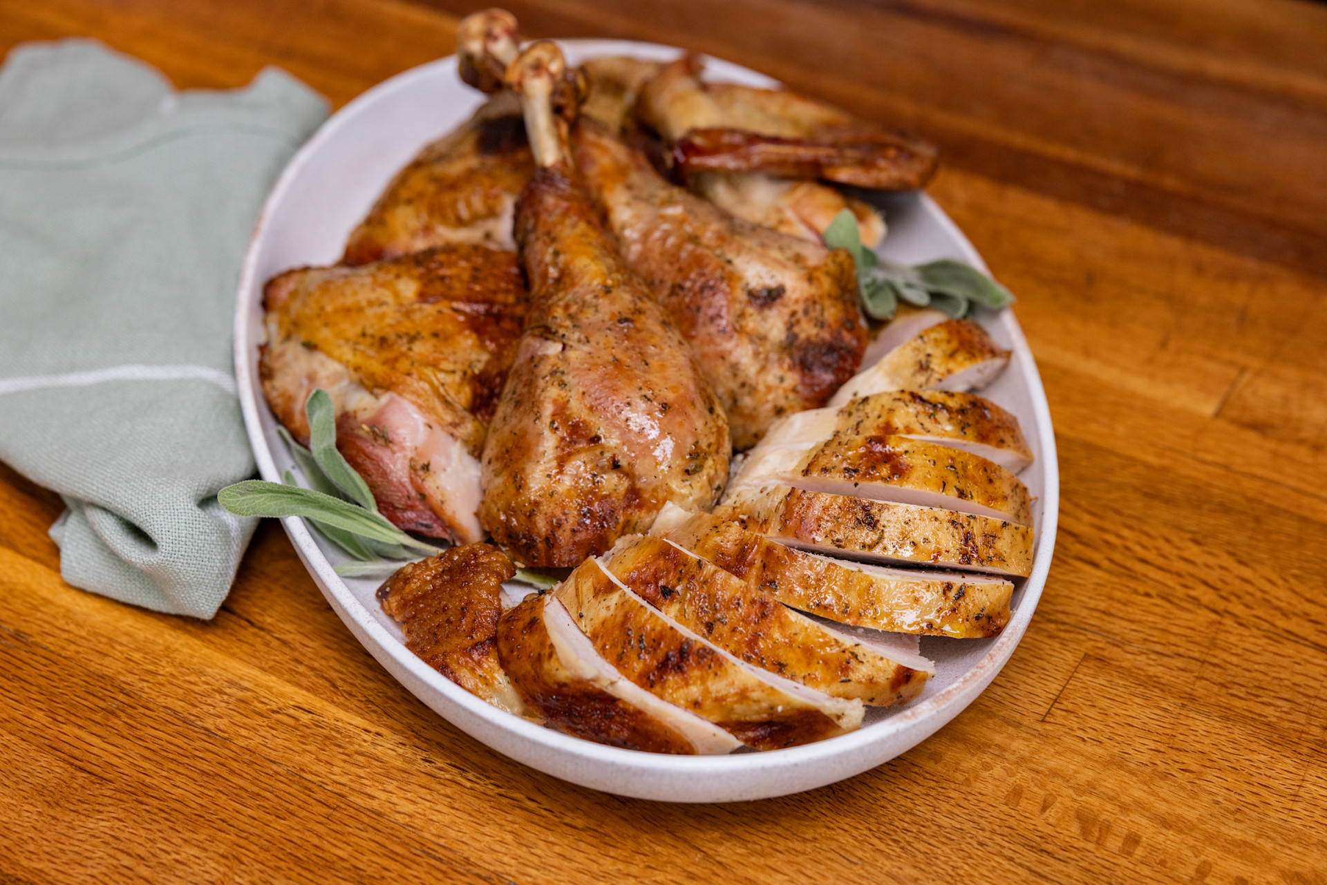 whole sliced turkey on a white plate