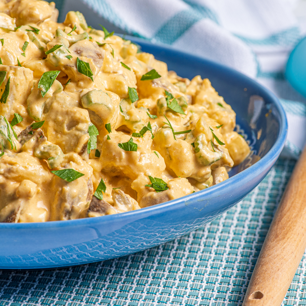Mom's Potato Salad with Woodfired Garlic on a blue bowl
