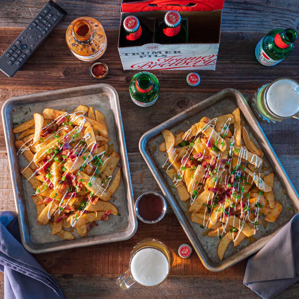 Photo of potato wedges on sheet tray with toppings