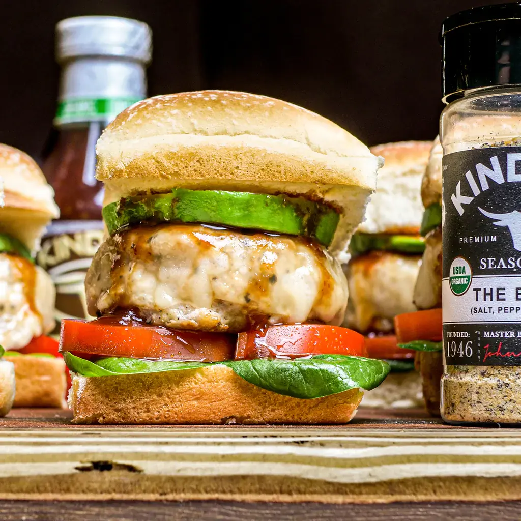Side view of chicken burger with melted cheese and toppings