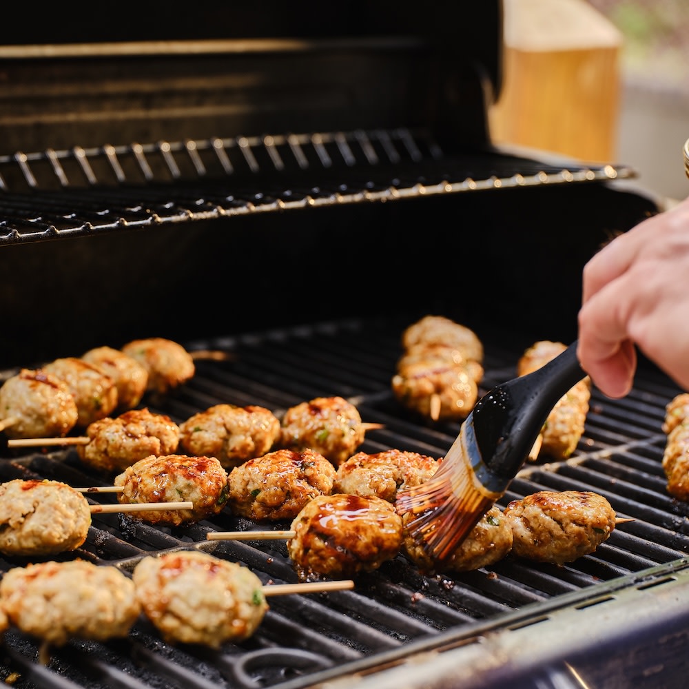 Japanese meatballs on a grill 