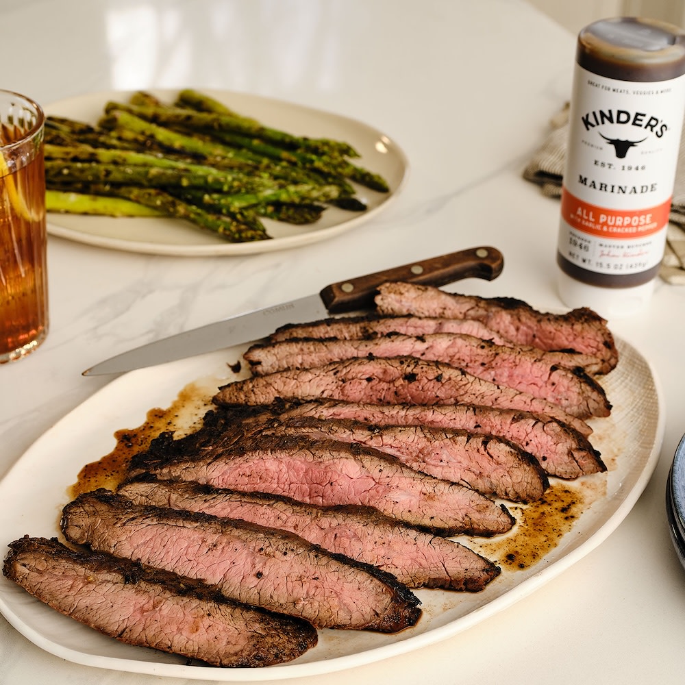 Sliced grilled flank steak on cutting board