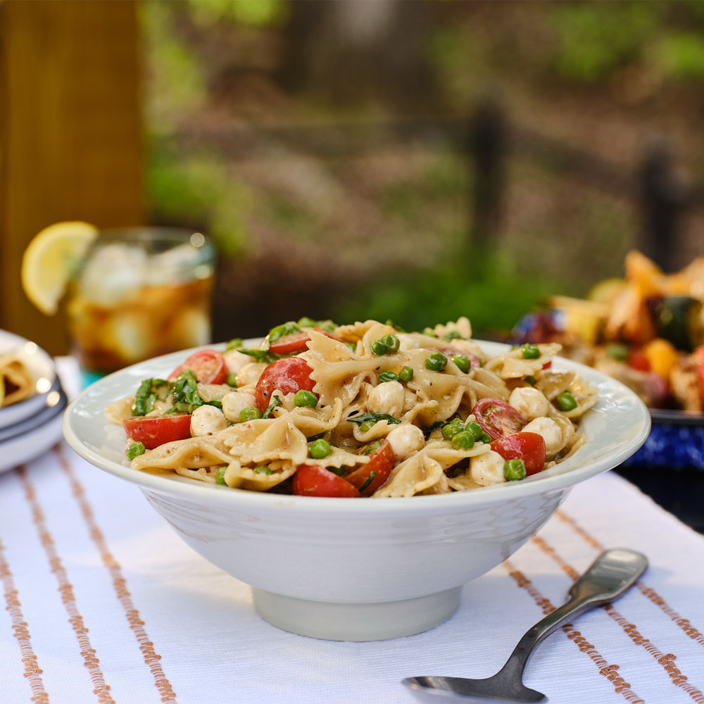 Pasta salad in a white bowl on the table