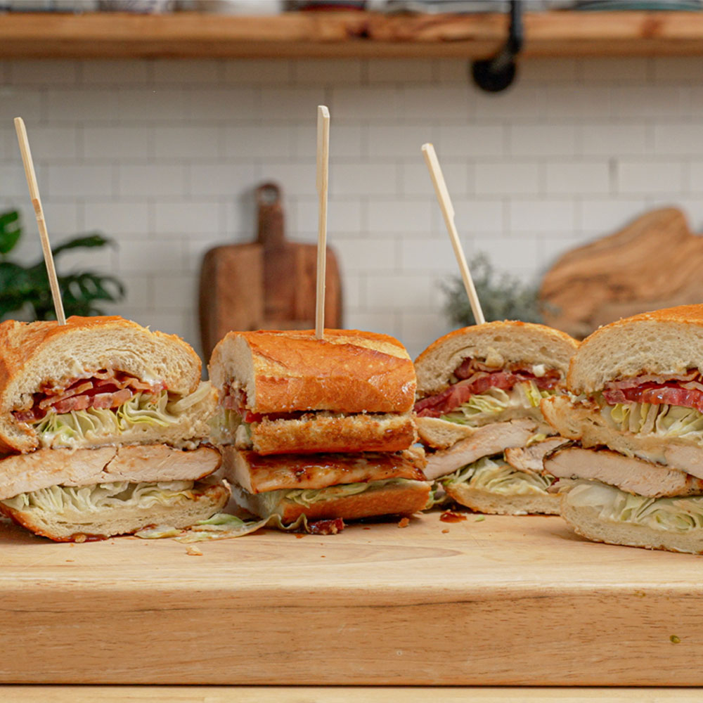 Sliced grilled chicken club sandwich