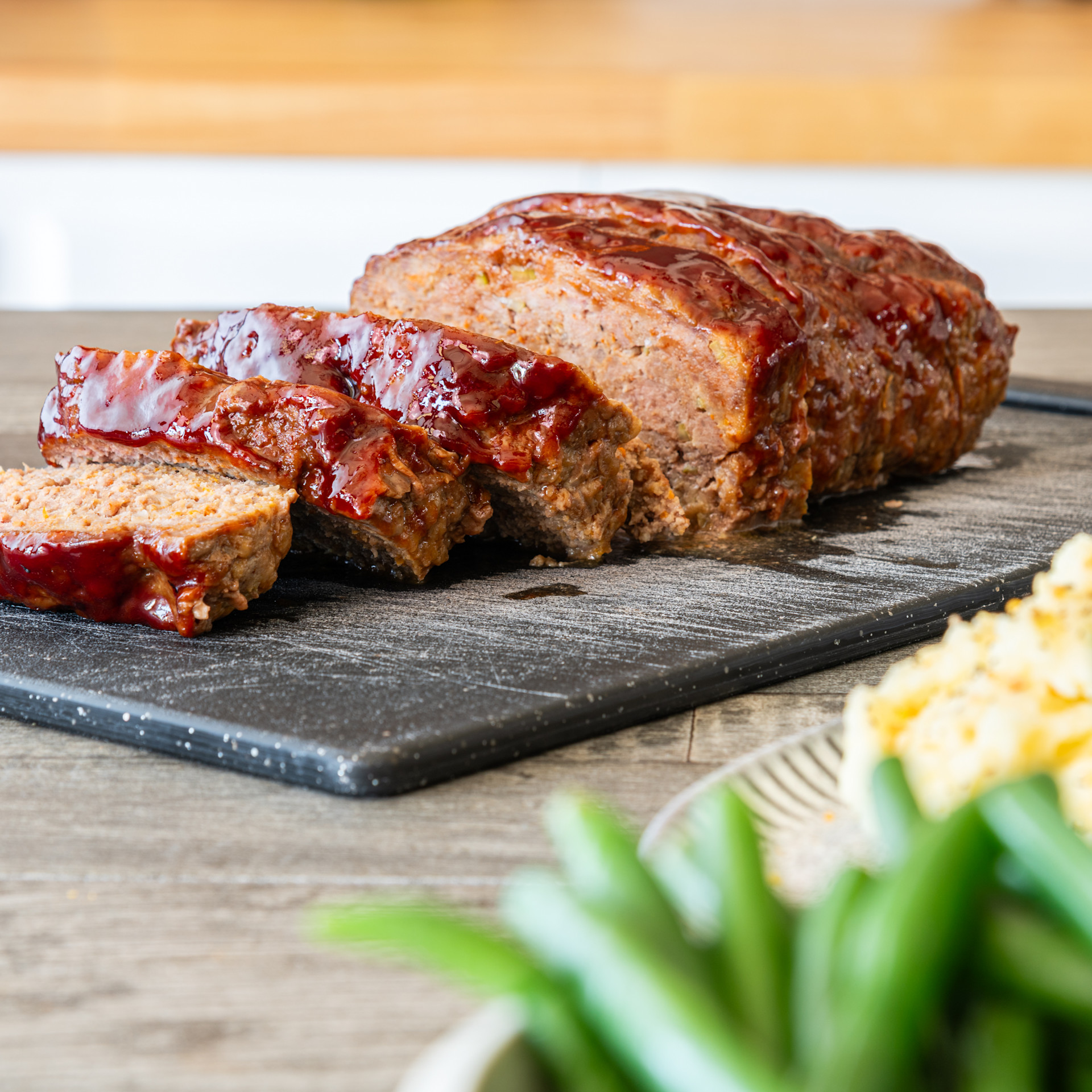 sliced meatloaf on a cutting board