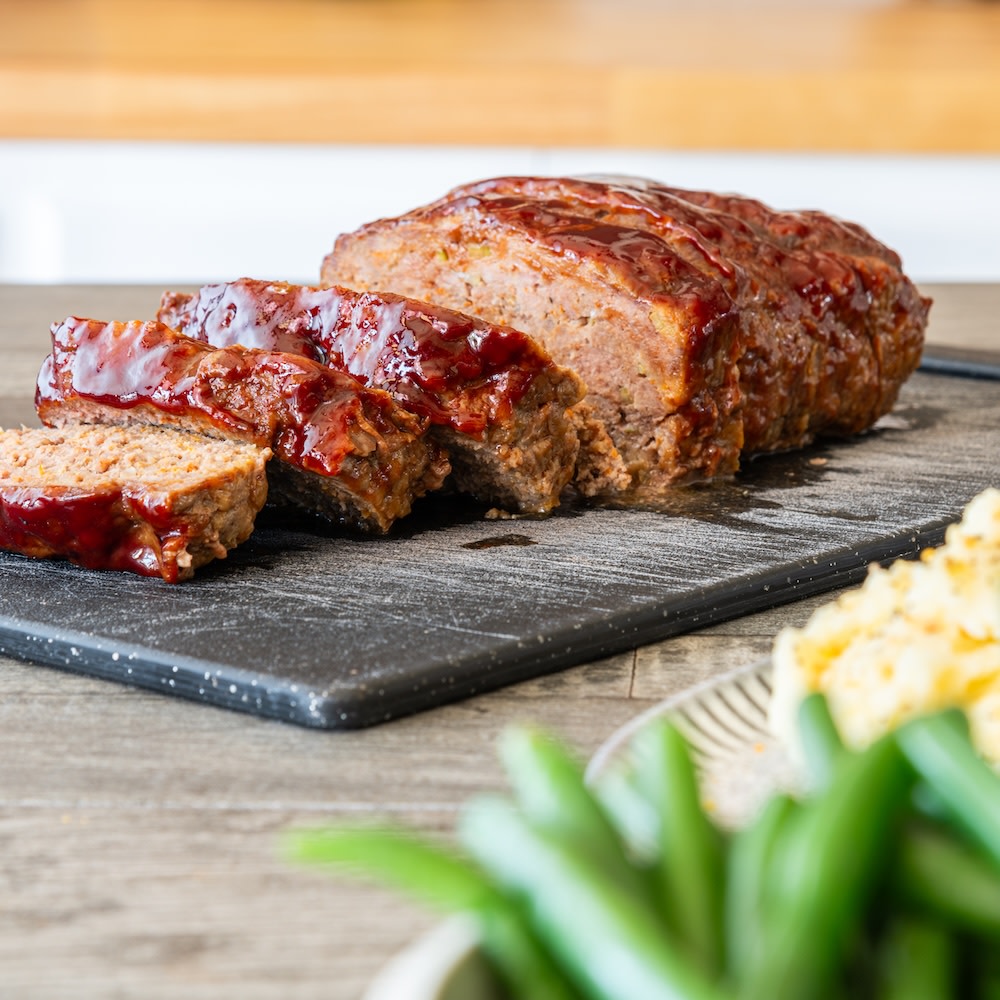 sliced meatloaf on a cutting board
