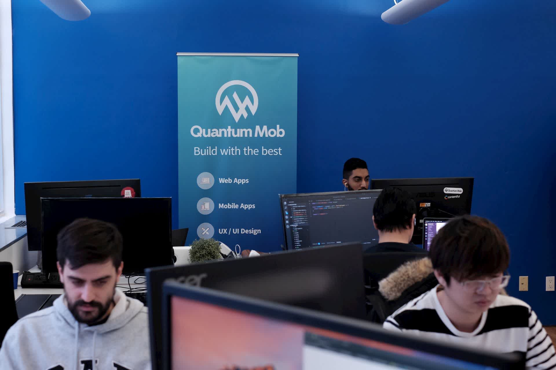 Quantum Mob staff working at computers