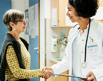 Incontinence patient shaking hand with a doctor