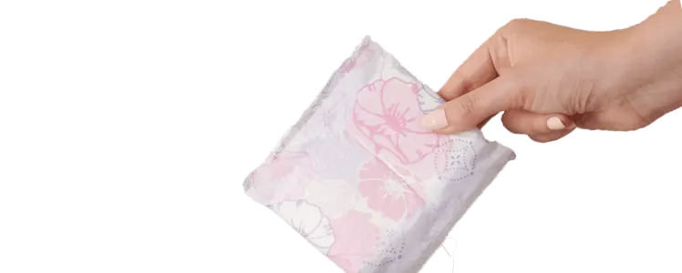Person holding a wrapped Always Discreet pad or liner