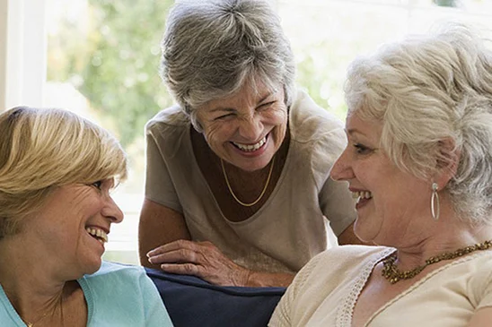 Older women laughing together