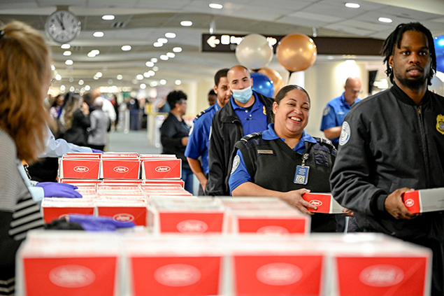 2025 Federal Airport Employee Appreciation Day photo of federal employees receiving lunch boxes.  