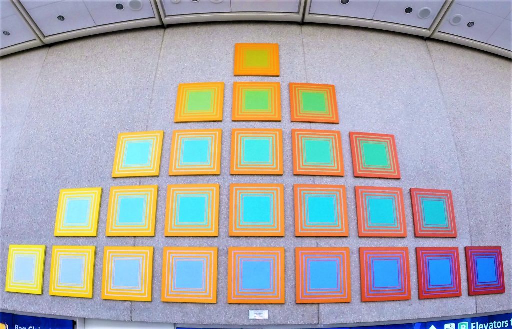 Artist: Richard Anuszkiewicz (1930-2020)
Details: 1981, 15 by 27 feet, Silkscreen on Masonite
Collection: GOAA Art Collection
Location: Terminals A & B, Level 3, Security Checkpoint for Gates 1-59