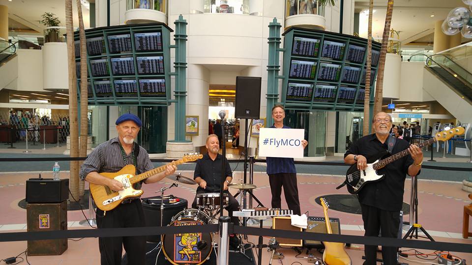 Smokin Torpedoes June 19 2016 playing instruments in the Grand Atrium area at MCO.