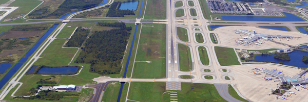 1989 color photo of Runway 35L/17R, MCO's third parallel runway, opening in preparation for the start of operations on gates 60-99.