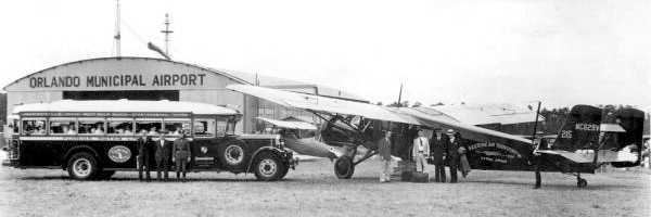An old 1946 black and white photo of Florida Motor Lines delivering mail to Eastern Air Transport at Orlando Municipal Airport.