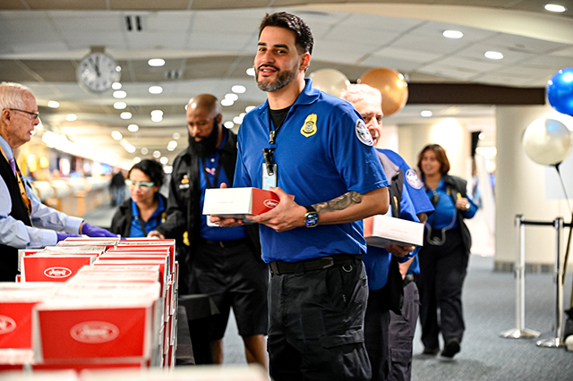 2025 Federal Airport Employee Appreciation Day photo of federal TSA employee receiving a box lunch.