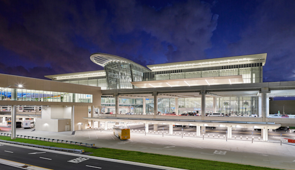 Nighttime, Terminal C Exterior - Front Elevation with dark blue sky.