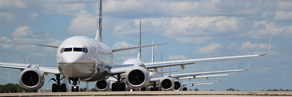 Planes are waiting in line on the MCO runway.