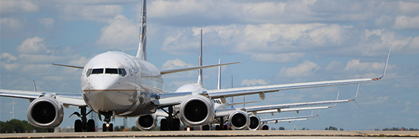 Planes are waiting in line on the MCO runway.
