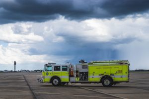 ARFF fire vehicle with GOAA tower in the background.